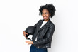 © luismolinero - Young African American woman with a motorcycle helmet isolated on white background extending hands to the side for inviting to come