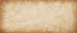 Fototapeta  - Long panoramic  vintage retro antique paper background. Light yellow-brown old paper texture. Rustic abstract old surface with vignette and copy space.