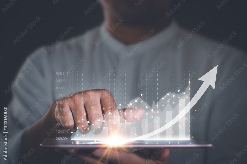 Businessman with a tablet in his hand And touching on the screen That ...