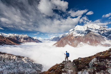 Wall Mural - hiker enjoys the view in the himalayan mountains