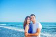 © blicsejo - Young happy couple on seashore