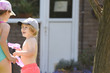 © tommoh29 - Kids playing with water in a garden on a sunny summer day
