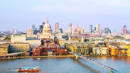 Sticker - London, UK. Aerial view of skyline in London, England, UK with famous modern skyscrapers and other buildings during the evening. Time-lapse with moving boats at Thames river, zoom in