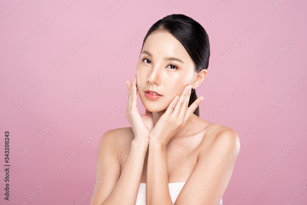 Beautiful Young Asian woman with clean fresh white skin touching her ...
