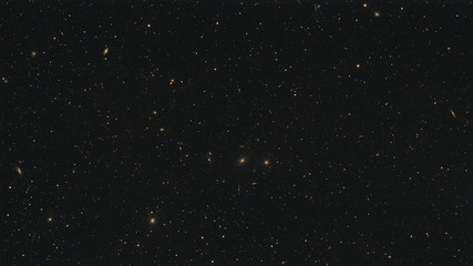 Wall Mural - Galaxies forming the Markarian's Chain as part of the Virgo Cluster in the constellation Virgo photographed from Schmalenberg in Germany.
