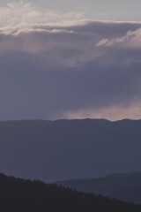 Wall Mural - Evening landscape with Layers of mountain.