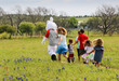 © Billy McDonald - Children Chasing The Easter Bunny Through Blue Bonnets, Washington County, Texas, USA