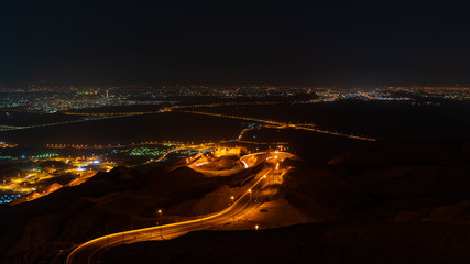 Wall Mural - Jebel Hafeet night view of the Al Ain city