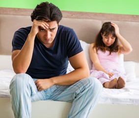 Woman and man in the bedroom after conflict