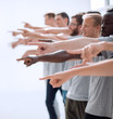 © ASDF - confident group of young men pointing ahead.