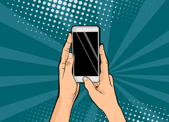 hands holding smartphone pop art.hands hold a mobile phone. vector illustration in comic style.