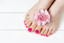 Pink Pedicure With A Flower On White Wooden Background, Top View, Copy Space