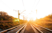 Electrified Railway On Sunset Background