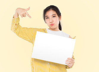 young asian woman excited expression and holding blank paper , advertising banner  