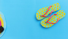 Travel Background Concept / Items Summer Travel Accessories With Flip Flops For Traveler's On Blue Background
