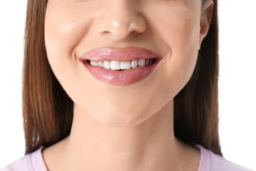 Wall Mural - Young woman with beautiful smile on white background, closeup