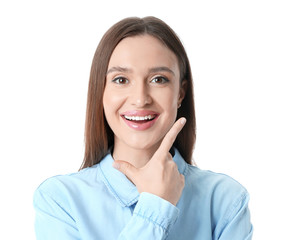 Wall Mural - Young woman with beautiful smile on white background