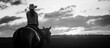 Girl ride on a horse in farm open field at afternoon dark sunset time.black and white 