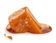 Soft melted caramel isolated on a white background. Salted toffee candies with caramel sauce.Soft melted caramel isolated on a white background. Salted toffee candies with caramel sauce.