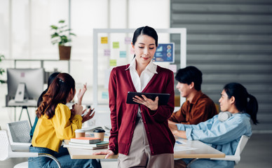 creative boss use tablet planning work while ux developer and ui designer brainstorm about mobile app interface design on whiteboard in meeting at modern office.digital creative agency
