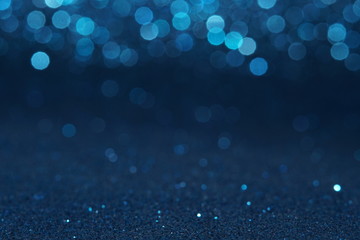 blue sparkling lights festive background with texture. abstract christmas twinkled bright bokeh defo