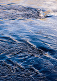 Fototapeta Konie - Flowing water in a river