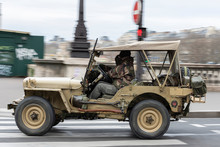 Old And Classic Militrar Off-road Vehicle. American Willy Through The City Center