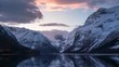 Lake with snowy mountains in the background during sunset. Fjords, Norway
