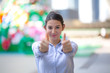 © FotoArtist - young business women show thumb up to camera