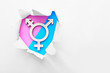 Symbol of transgender visible through torn paper on color background