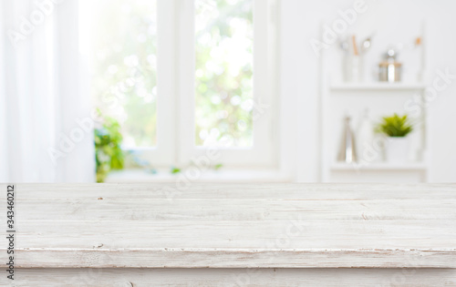 Fotomural Free space table top background on blurred kitchen window interior