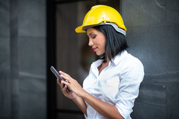 Young engineer wearing a helmet while inspecting work