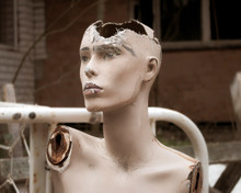 Old Abandoned Broken Sad Mannequin. Post-apocalyptic Future. Old Abandoned Building. Hopelessness And Despondency, Forgetfulness. Old Vintage Photo.