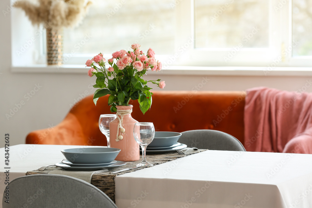 Bouquet of flowers on table in dining room