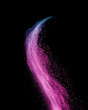 Colorful powder splash in purple colors on a black background.