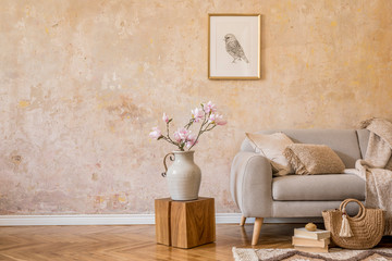 Wall Mural - stylish concept of living room interior with design grey sofa, mock up picture frame, dried flower, 