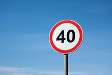 International Traffic Sign 'Speed Limit' (to 40 Km Per Hour). Blue Sky Is On  Background