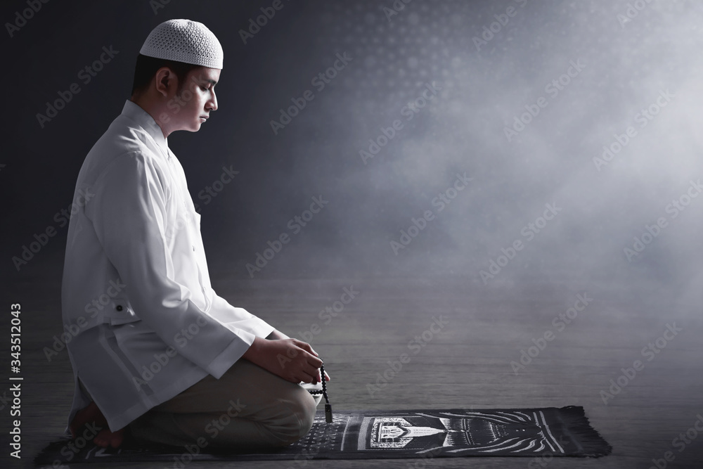Religious muslim man praying with rosary beads Stock Photo | Adobe Stock