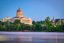 Jefferson City, Missouri, USA Downtown View On The Missouri River With The State Capitol At Dusk.