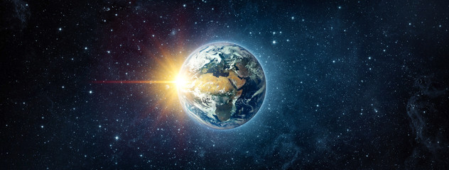 Wall Mural - panoramic view of the earth, sun, star and galaxy. sunrise over planet earth, view from space. conce