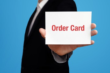 Order Card. Business man in a suit holds card at camera. The term Order Card is in the sign. Symbol for business, finance, statistics, analysis, economy