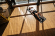 © igor_kravtsov - Overhead view of muscular young woman lying on exercise mat. Relaxing after workout at gym