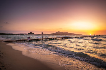 Wall Mural - A wooden pier at Playa de Muro beach in Mallorca