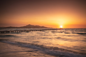 Wall Mural - A wooden pier at Playa de Muro beach in Mallorca