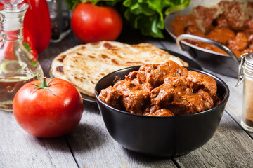 Wall Mural - Chicken tikka masala served with bread naan