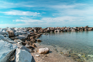 Marina di Pisa, rock in the coast at midday