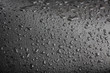 Drops of water on a black surface.