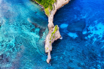 Aerial view on the sea and rocks. Blue water background from top view. Summer seascape from air. Travel - image