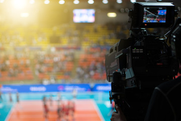 Wall Mural - Blurred background of professional volleyball league cup championship international competition live sport news tv show from indoor arena with fans crowd cheer up and watching from stand for victory