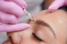 Female Getting Permanent Eyeliner Tattoos Enhancement Coloring In Spa